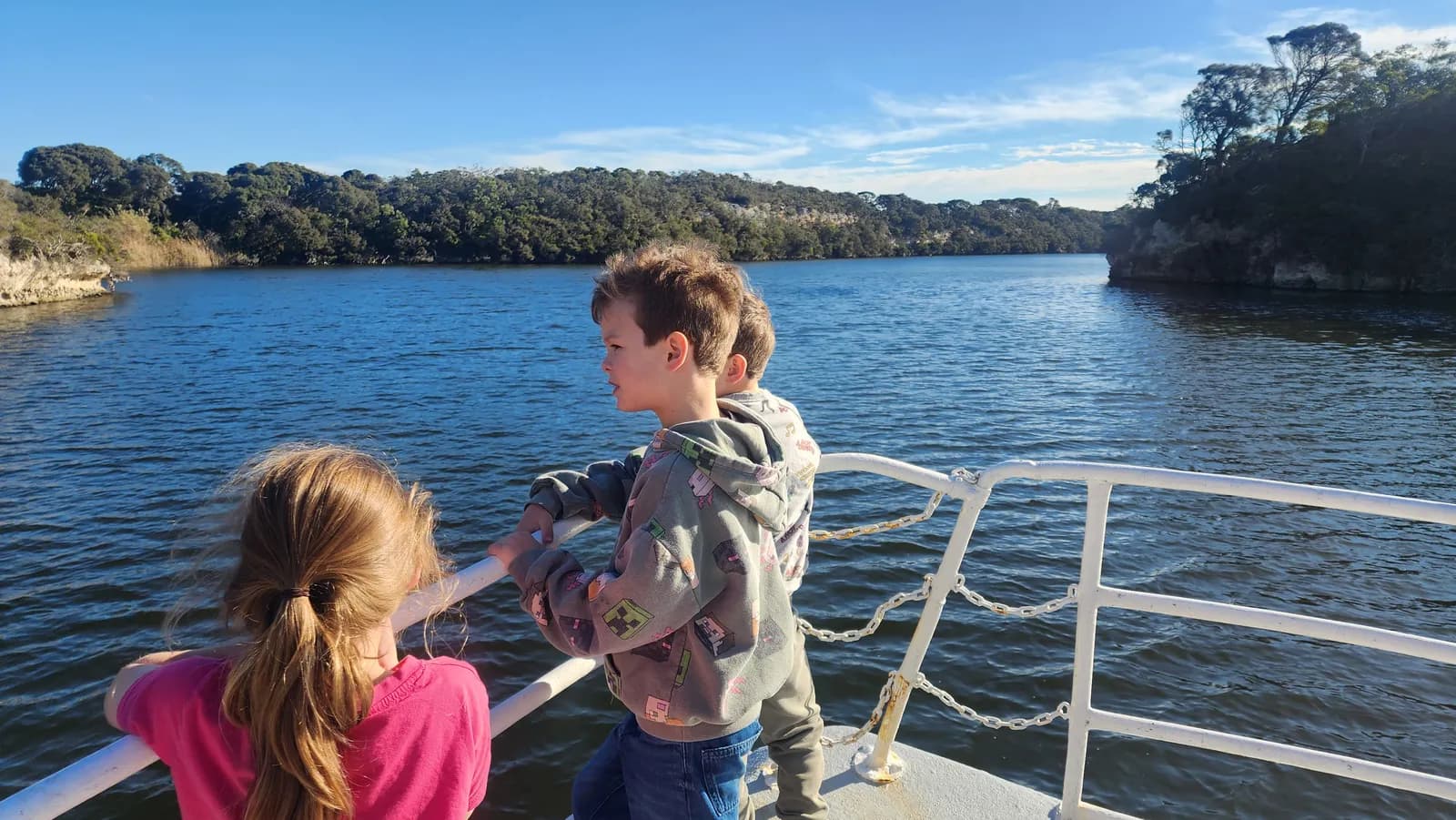 Children at the bow rail of MV Mini Munya watching the river go by